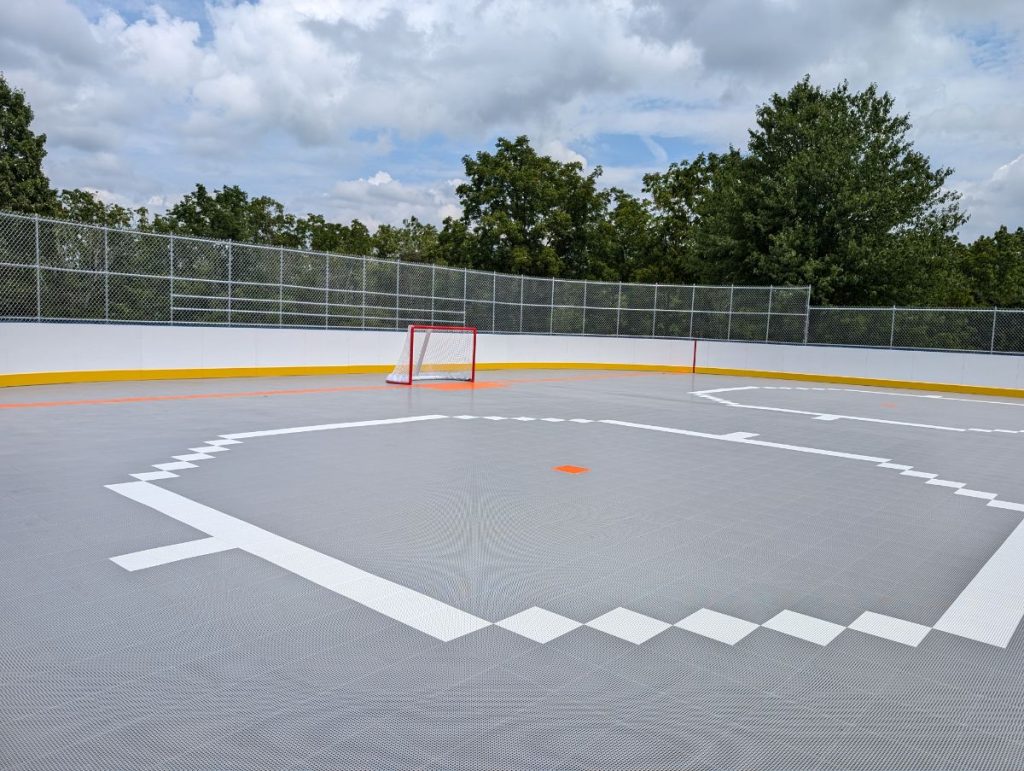The Rink at Community Park picture of completed rink in New Hanover PA (Gilbertsville) with gray MS3 tiles and Athletica Dasher Boards